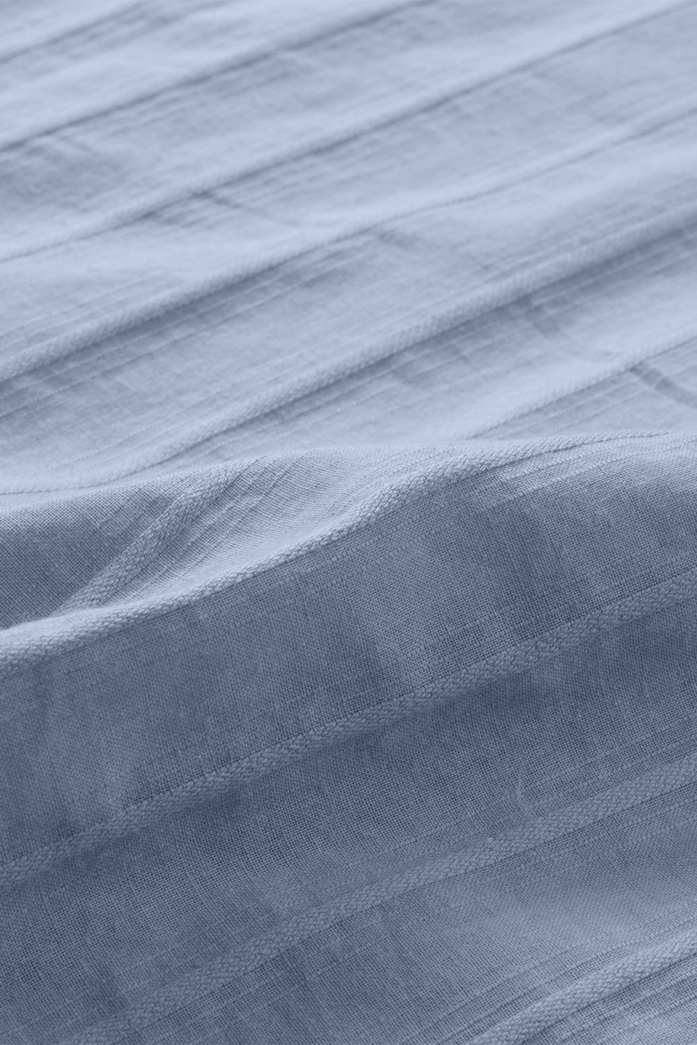 Chemise à manches longues texturée bleue avec poche boutonnée
