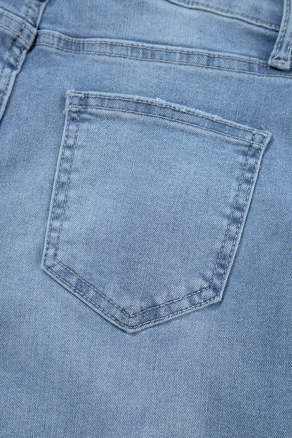 Jeans rasgados com zíper e botão assimétrico de cintura alta azul crepúsculo