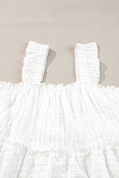 Robe fluide sans manches à carreaux blancs et bretelles à volants