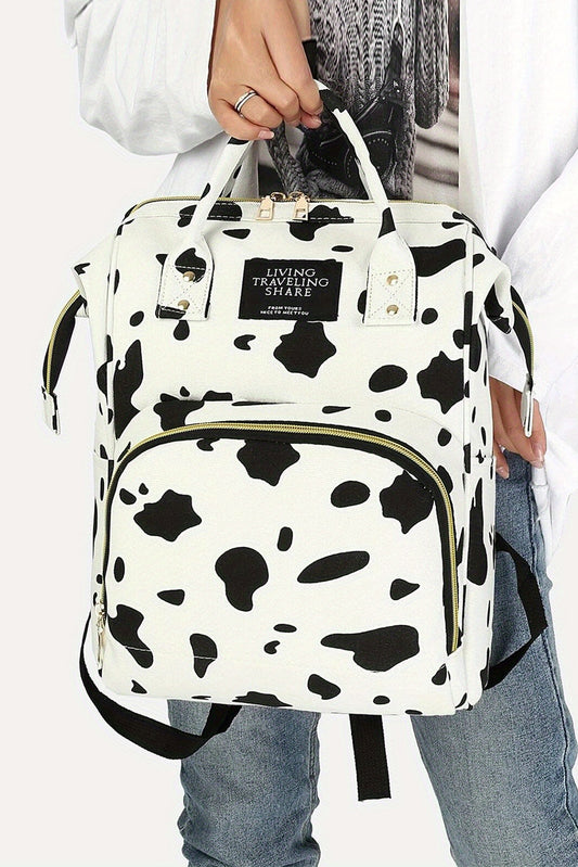 Mochila de lona com vários bolsos com estampa de vaca branca