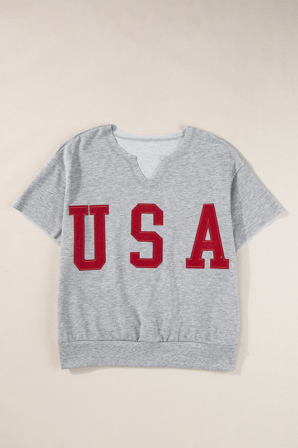 T-shirt ample gris clair avec lettrage USA et col cranté