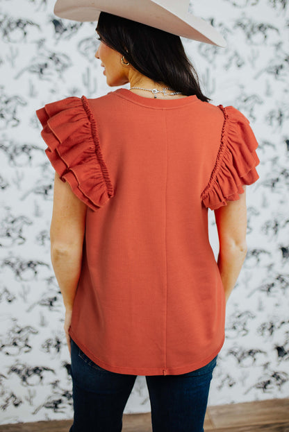 Camiseta laranja com babados e manga gola redonda