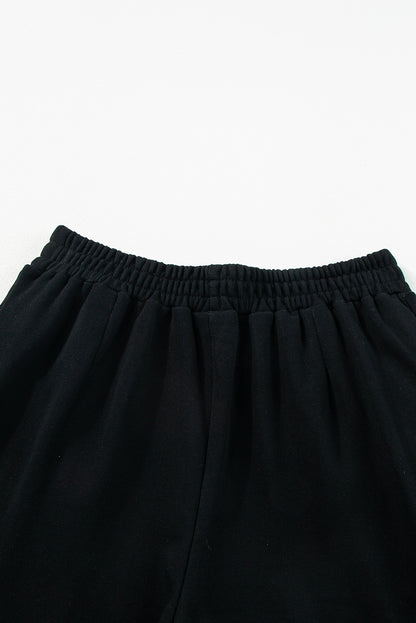 Conjunto de duas peças com top preto e calça larga