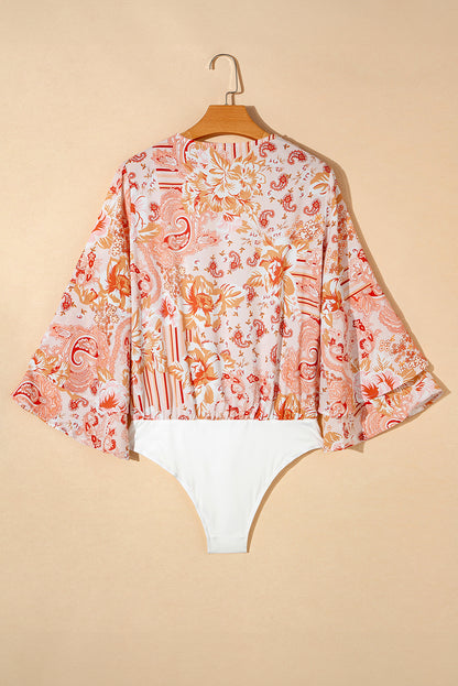 Body laranja com estampa floral e babados manga sino com decote em V