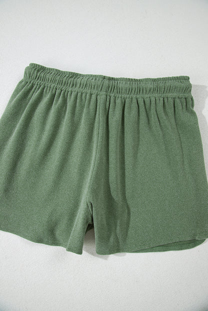 Conjunto de pulôver e shorts recortados de duas peças de lã verde